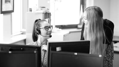 Two team members working together